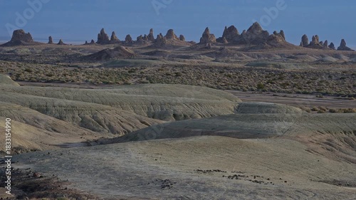 Eroded sediment mounds by tufa towers.