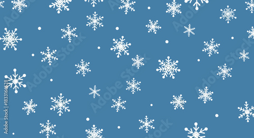 Delicate snowfall pattern on cerulean backdrop creating a winter wonderland atmosphere