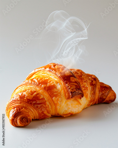 Freshly baked croissant releasing visible steam on a clean background. Golden, flaky, buttery pastry in high detail.