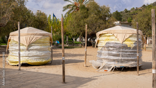 Fototapeta Naklejka Na Ścianę i Meble -  packaging beach furniture on the seashore on the sand