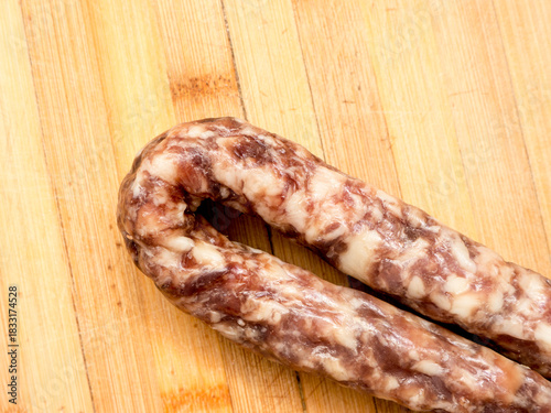 Sausage on a wooden board.