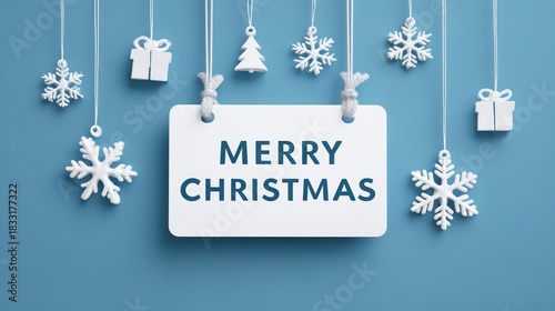 Merry christmas sign with white snowflakes and gift ornaments on blue