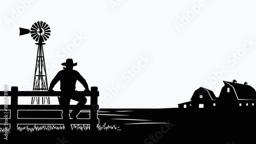 Silhouette of a cowboy on a fence with a windmill and barns in the background in a rural landscape