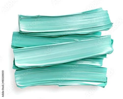 Stacked horizontal smears of bright turquoise cosmetic product against a white background