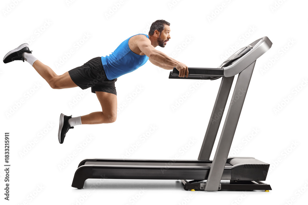 Fototapeta premium Strong man falling from a treadmill with legs in the air