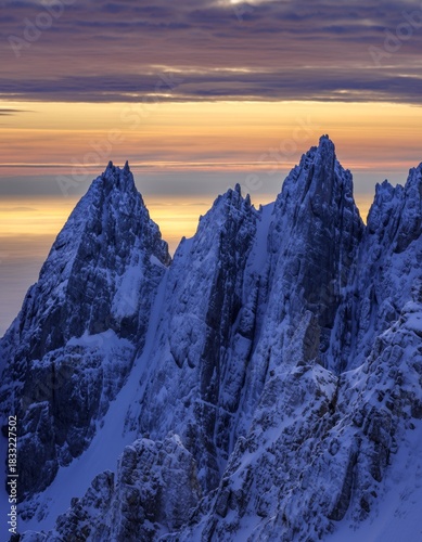 Majestic Snow-Capped Peaks Under Stunning Golden Hour Sky