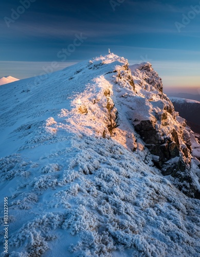Snowy Mountain Peak During Sunrise with Dramatic Sky and Clouds