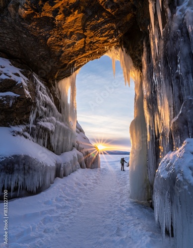 Mesmerizing Sunset Through Ice-Covered Cave in Winter Wonderland