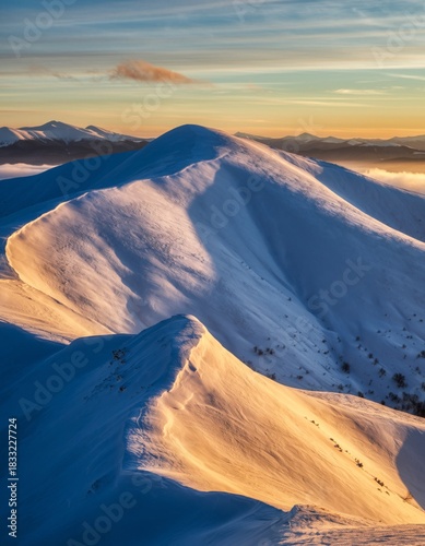 Majestic Snowy Mountain Landscape at Sunrise Under Colorful Sky