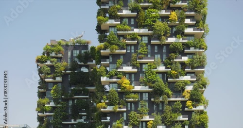 Detail of Bosco Verticale towers facade, covered by shrubs and trees, Milan, Italy