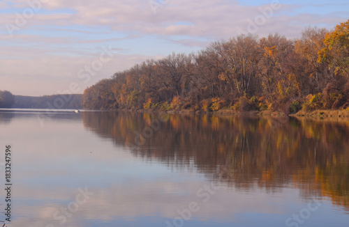 autumn trees reflected in water