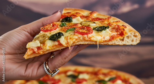 Woman holding a hot slice of margherita pizza with melted cheese, tomato, and basil. Delicious italian fast food concept for street food advertisement.