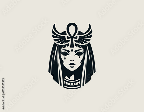Mysterious black and white portrait of a powerful Egyptian queen wearing an elaborate winged headdress. Ancient mythology concept