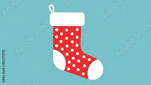 A festive red and white polka dot christmas stocking with a white cuff and loop hangs against a solid bright blue background symbolizing holiday cheer and gift giving
