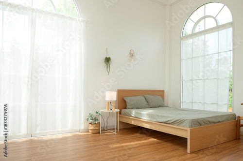 Cozy and Bright Bedroom Featuring a Minimalist Design With Natural Light in a Serene Space