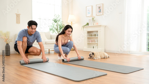 Wallpaper Mural Young Asian Couple Practices Wellness and Yoga With Their Pug in a Bright Indoor Space Torontodigital.ca