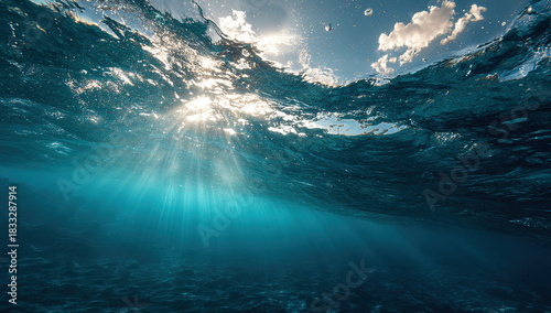 Underwater ocean scene with sunlight rays - Deep sea view - Aquatic environment