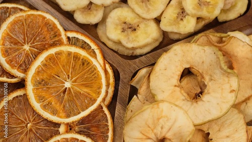 Fruits chips. Different types of crunchy fruits chips close up, rotation