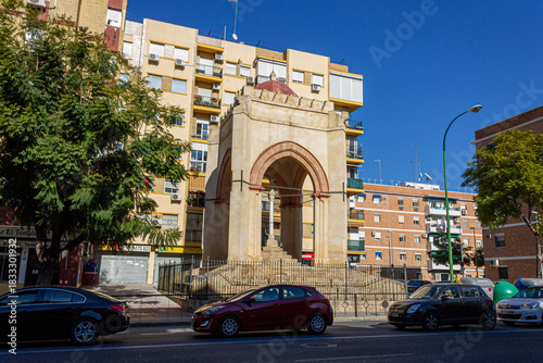 Seville, Spain. View of the 15th century Templete de la Cruz del Campo on Luis Montoto Street, a historic shrine linked to the origins of the city's Via Crucis and later to the Cruzcampo brewery