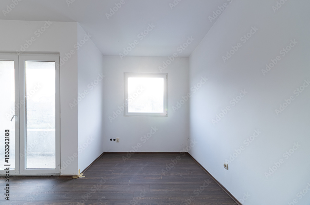 Fototapeta premium Empty Unfurnished Room with Window and Balcony Door