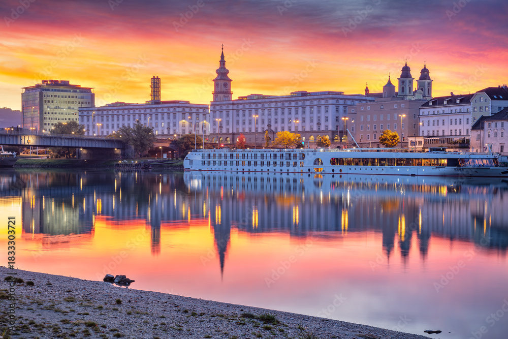 Fototapeta premium Linz, Austria. Cityscape image of riverside Linz, Austria at autumn sunrise with reflection of the city lights in Danube River.