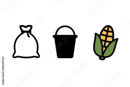 Tied sack, solid black bucket, and colorful ear of corn on the cob