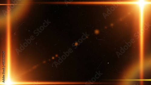 Abstract glowing orange light frame border effect with lens flare and dust particles overlay on a dark black background, perfect for cinematic or futuristic design