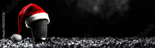  microphone with a santa hat on a black background, 