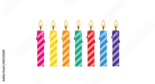 Set of seven colorful striped birthday candles with burning flames, representing a rainbow of colors, isolated on a clean white background.