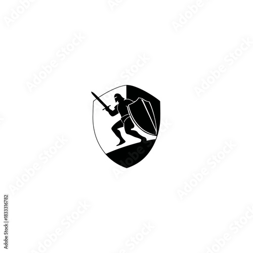 Silhouette of a warrior with sword and shield on shield shaped emblem