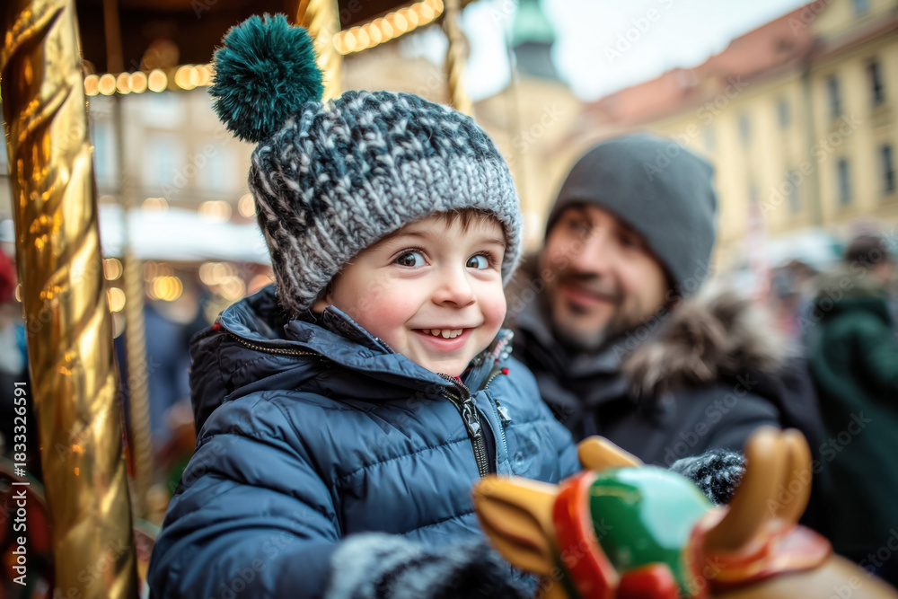Obraz premium Happy Child Riding Carousel at Christmas Market