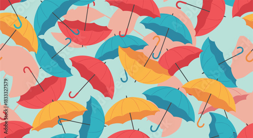 Seamless pattern of colorful open umbrellas in shades of red, yellow, and blue scattered randomly against a light blue background.