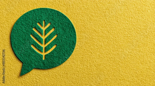 Green leaf is drawn on a yellow background. The leaf is surrounded by a circle, which is also green