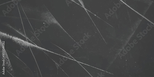 Abstract white chalk lines on a dark gray textured surface, artistic scratches