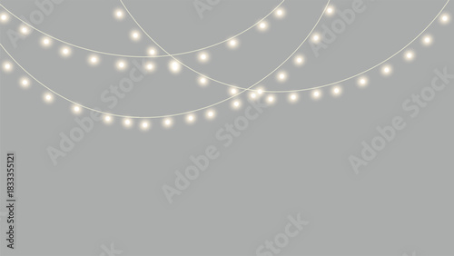 Soft glowing yellow lights gently hanging in a warm festive arrangement, creating a cozy seasonal atmosphere perfect for holiday visuals