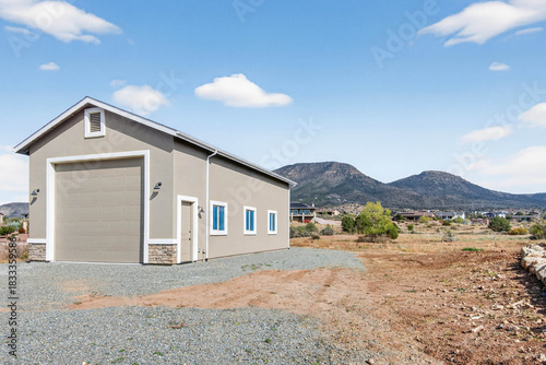 Freestanding Garage Structure Designed For Workshop Activities And Equipment Storage Close To Residence