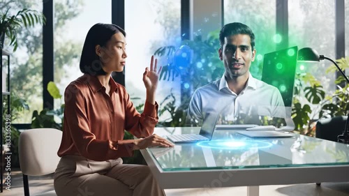 Woman and man communicate through holographic virtual display for future technology meeting or remote work collaboration