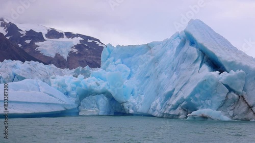 Perito Moreno Glacier in Patagonia showing massive ice wall, turquoise water, frozen textures, rugged wilderness, dramatic landscape, natural environment, climate scenery majestic travel area backdrop