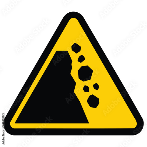 A yellow triangular warning sign indicating danger from falling rocks. The sign features a black silhouette of a cliff with rocks descending.
