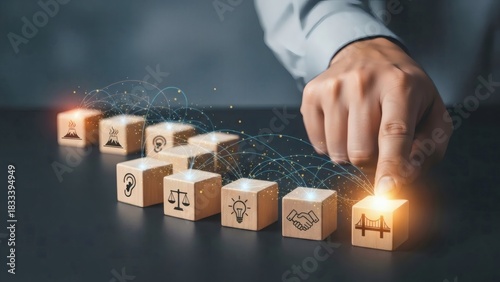 Conflict resolution skills positive confrontation team problem solving. Hand connecting illuminated wooden blocks symbolizing communication and cooperation pathways for constructive conflict.
