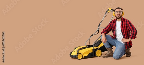 Young man with modern lawn ...