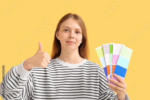 Young woman with color samp...