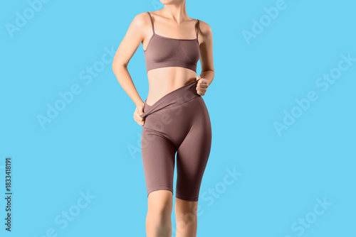 Young woman in cycling shor...