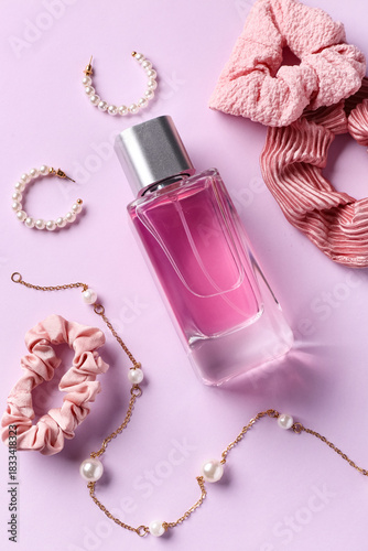 Bottle of perfume with earr...