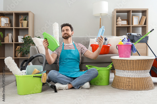 Male janitor with cleaning ...