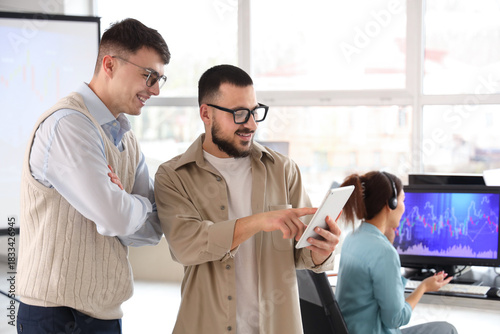 Male traders working with t...