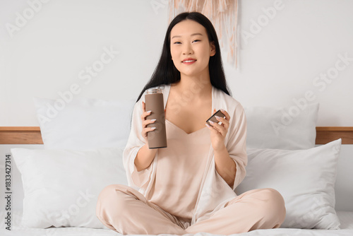 Young Asian woman with ther...