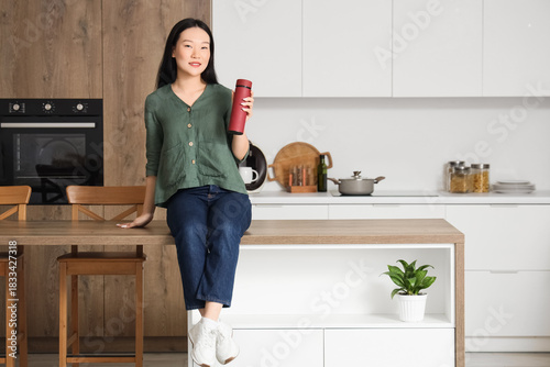 Young Asian woman with ther...