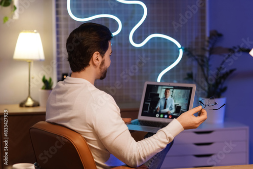 Handsome man with laptop vi...