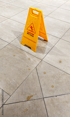 Yellow wet floor warning sign
Dirty floor
